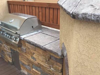 Composite Deck & Stone Patio  from Woodland Park Deck Builder