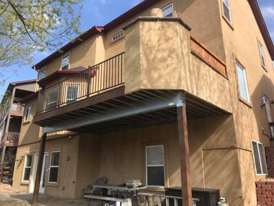 Composite Deck & Stone Patio  from Woodland Park Deck Builder